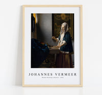 Johannes Vermeer - Woman Holding a Balance 1664