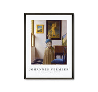 
              Johannes Vermeer - Lady Standing at a Virginal 1670-1672
            